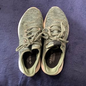 Green Adidas athletic shoes